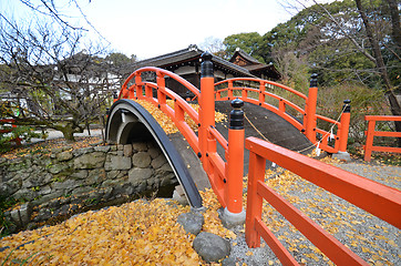 Image showing Yellow leaves on the bridge in Shimogamo-jinja Shrine Kyoto 