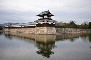 Image showing Entrance at Hiroshima castle with wall and water pond to protect