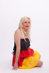 Image showing Woman wrapped with Germany flag