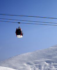 Image showing Gondola lift and off piste slope at sun morning