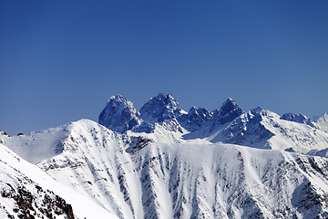 Image showing Snowy rocks at nice sun day