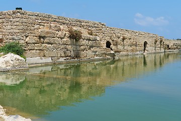 Image showing Ancient wall reflecting in the pond 