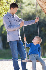 Image showing family at swings