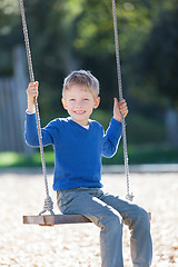 Image showing boy at swings