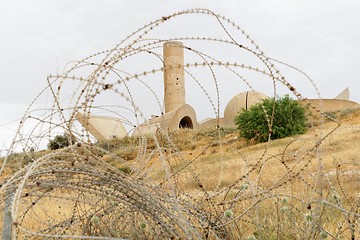 Image showing Monument to the Negev Brigade in Beer Sheva, Israel, seen through the barbed wire