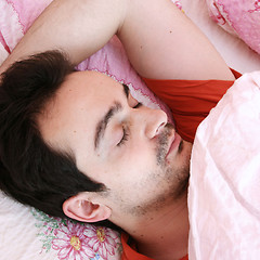 Image showing Young man sleeping .