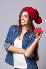 Image showing Smiling woman holding credit card