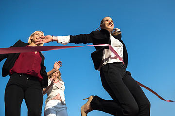 Image showing business people running on racing track