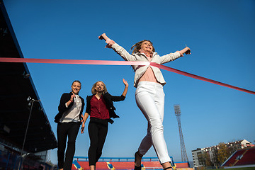 Image showing business people running on racing track