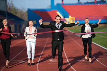 Image showing business people running on racing track