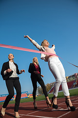 Image showing business people running on racing track