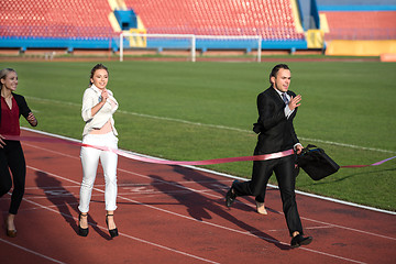 Image showing business people running on racing track