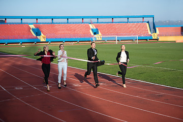 Image showing business people running on racing track