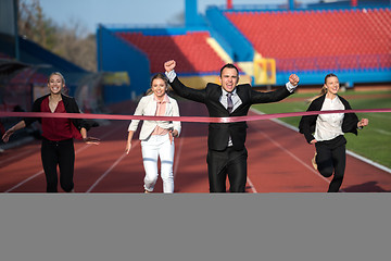 Image showing business people running on racing track