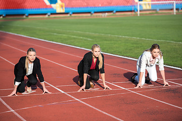 Image showing business people running on racing track