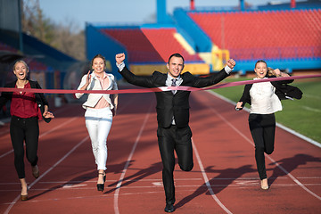 Image showing business people running on racing track