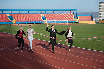 Image showing business people running on racing track