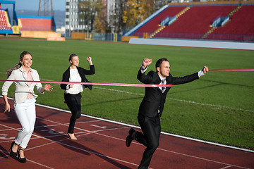 Image showing business people running on racing track