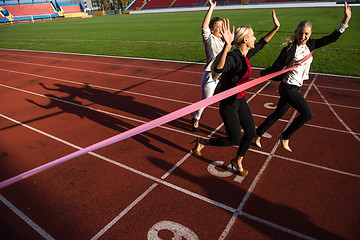 Image showing business people running on racing track