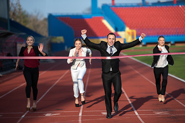 Image showing business people running on racing track