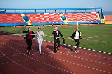 Image showing business people running on racing track