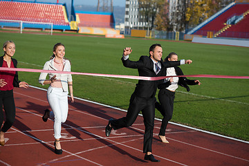 Image showing business people running on racing track