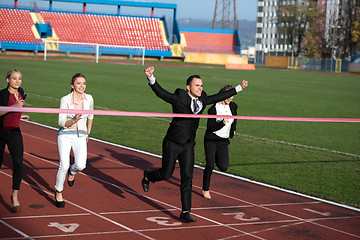 Image showing business people running on racing track