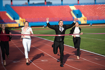 Image showing business people running on racing track