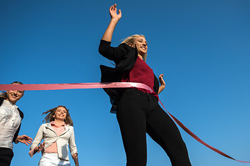 Image showing business people running on racing track