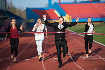 Image showing business people running on racing track