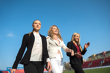 Image showing business people running on racing track