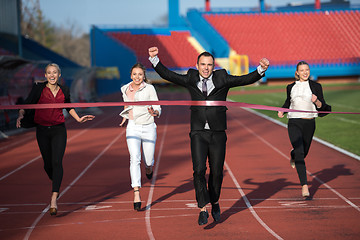 Image showing business people running on racing track