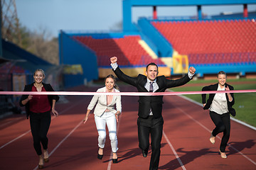 Image showing business people running on racing track