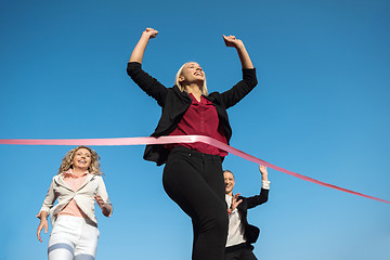 Image showing business people running on racing track