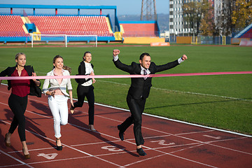 Image showing business people running on racing track