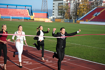 Image showing business people running on racing track