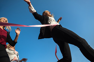 Image showing business people running on racing track