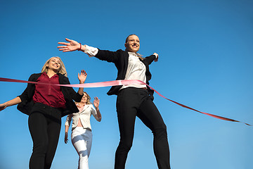 Image showing business people running on racing track