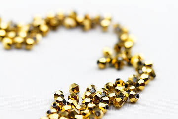 Image showing Golden glass beads