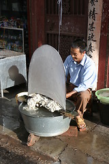 Image showing Man producing silk in China