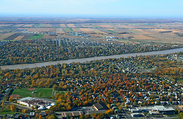 Image showing Aerial view of town near river