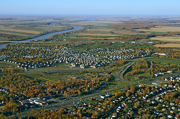 Image showing Aerial view of suburban neighborhood near highway