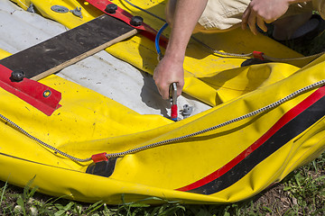 Image showing Pumping rubber boat