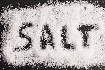 Image showing The word salt written into a pile of white granulated salt