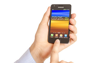 Image showing Hand holding the Samsung Galaxy S2