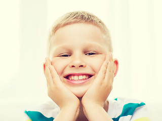 Image showing smiling little student boy at home