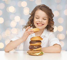 Image showing happy smiling girl with junk food