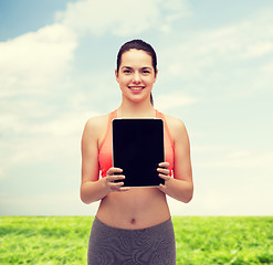 Image showing sporty woman with tablet pc blank screen