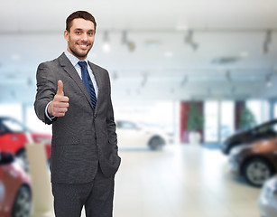 Image showing smiling businessman showing thumbs up