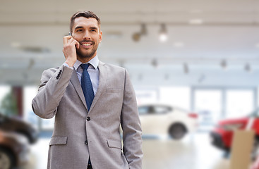 Image showing smiling businessman talking on smartphone